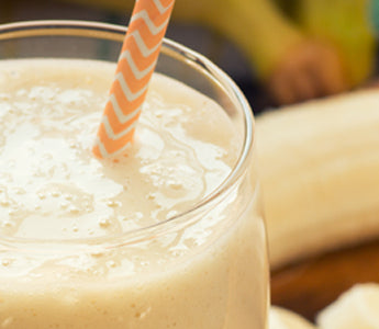 smoothie in glass with straw