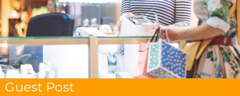 Young woman is buying a watch at the shopping mall